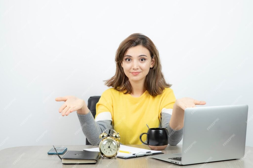 photo-female-office-worker-sitting-desk-showing-opened-palms-high-quality-photo_2831-9688-1024x683 The Role of a Freelance Business Assistant for Small and Medium Business in 2024